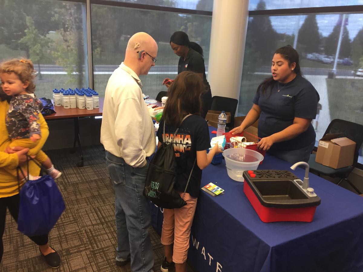 Loudoun Water staff speaking with customers at an event