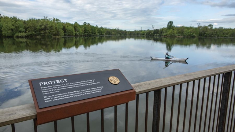 protect sign and kayaker