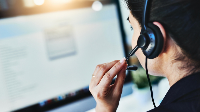 woman with headset and computer