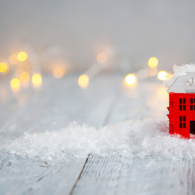 building with snow and twinkle lights