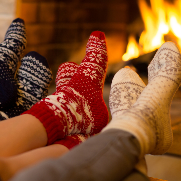 feet warming near fireplace