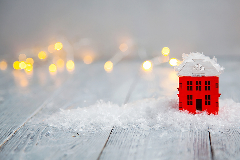 building with snow and twinkle lights