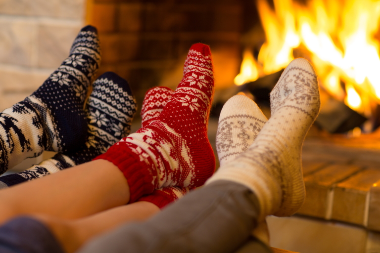feet warming near fireplace